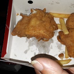 KFC - This is what they serve as a thigh. It's HALF a thigh cut just along side of the bone so they can serve 2 meals with one thigh. Disgusting!!