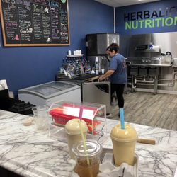 Healthy’s Nutrition - Behind the counter menu with tea & smoothies to go! (Bar seating not shown)
