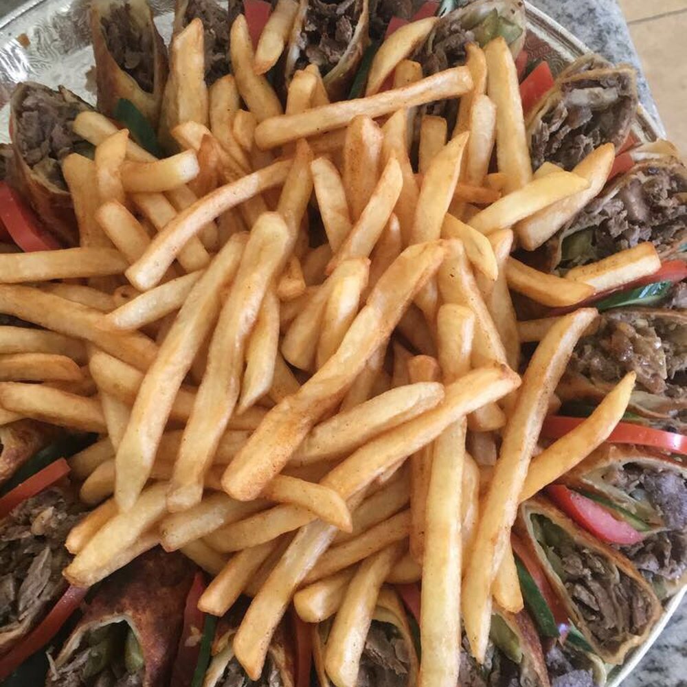 a platter of french fries and steak a platter of french fries and steak