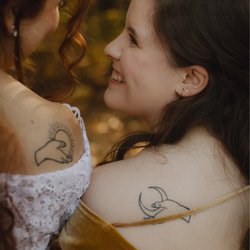 Studio 42 - Matching tattoos by Garrett, still beautiful after 3 years!