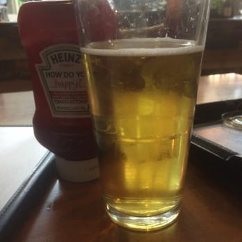 Tin Fish - This HUGE beer is only $2 and best part is it's free each time u wear a tin fish shirt in! - Seafood Near Me - Okeechobee, Florida