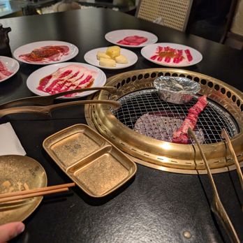 Nikushou Sakai - On the grill: sake clams and house special marinated beef - Japanese Near Me - Flushing, New York