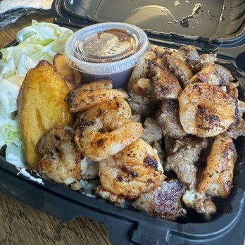 Khrissy's Kitchen - Surf & Turf Dinner: Jerk chicken, shrimp, rice, plantain, and salad, with a jerk BBQ sauce. - Food Trucks Near Me - Lexington , North Carolina Khrissy's Kitchen - Surf & Turf Dinner: Jerk chicken, shrimp, rice, plantain, and salad, with a jerk BBQ sauce. - Food Trucks Near Me - Lexington , North Carolina