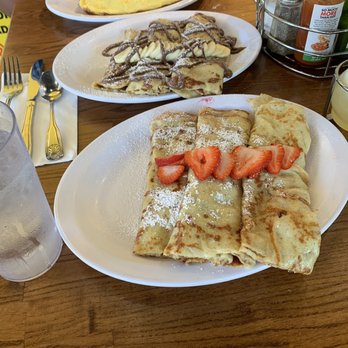 Eggs 'n Things Ko Olina - Starting with these amazing Strawberry and Banana/Nutella Crepes ! With my Bf's Portuguese Sausage omelet in the back. - American Near Me - Kapolei, Hawaii