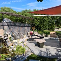 Cherry Chalet - Shared central patio with grill, pizza oven, seating, shade, & surrounded by fruit trees