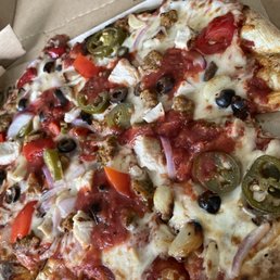 Mod size with Jalapeños, roasted garlic, onions,black olives, red peppers, spicy chicken sausage, double chicken, and extra red sauce!