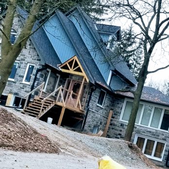 Master Trades Group - a fire hydrant in front of a house - General Contractors Near Me - Kitchener, Ontario