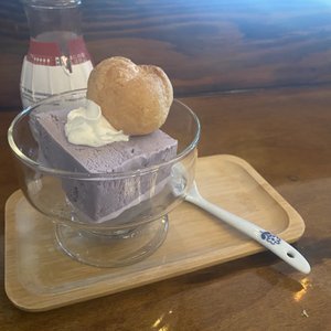 Photo of Doma - San Francisco, CA, United States. Dessert course, ube ice cream and a strawberry cream puff.