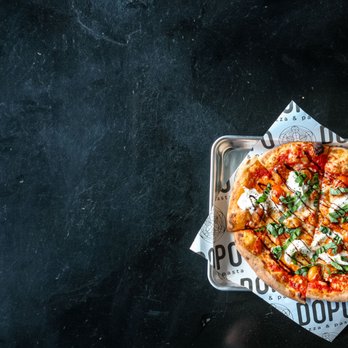 Dopo Pizza & Pasta - a pizza on a tray - Pizza Near Me - Reno, Nevada Dopo Pizza & Pasta - a pizza on a tray - Pizza Near Me - Reno, Nevada