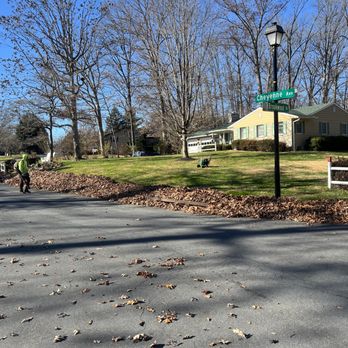 S K Services - a person riding a bike down a street - Lawn Services Near Me S K Services - a person riding a bike down a street - Lawn Services Near Me