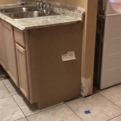 Midway point / Cabinet in / Tile going in / New sink and faucet