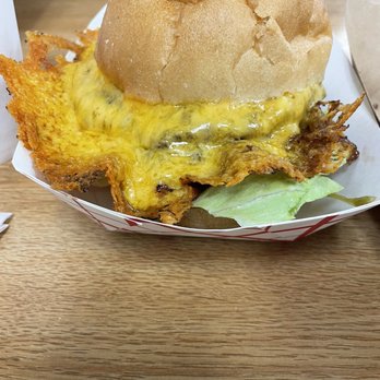 Squeez Inn - The Squeez Burger with cheese skirt. - Burgers Near Me - Stockton, Missouri