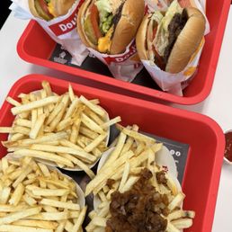 Double doubles and a hamburger animal style. Fries and fries with grilled onions.