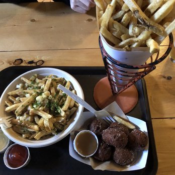 Duckfat - Poutine ($12), Belgian Frites ($9.75), Doughnut holes ($8) with garlic mayo and truffle ketchup - New American Near Me - Portland, Maine Duckfat - Poutine ($12), Belgian Frites ($9.75), Doughnut holes ($8) with garlic mayo and truffle ketchup - New American Near Me - Portland, Maine