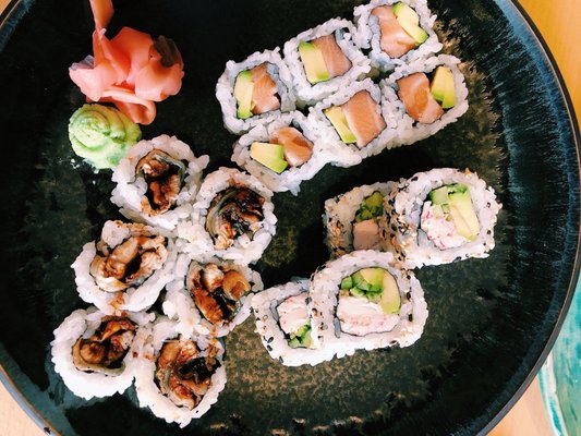 Photo of Yami Sushi Bistro - Prague, PR, CZ. BBQ eel, salmon avocado, and California rolls