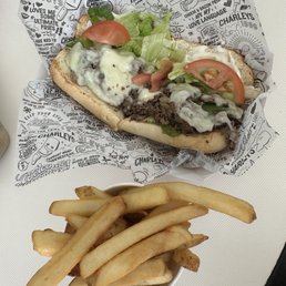 Regular Philly cheesesteak and regular fries Regular Philly cheesesteak and regular fries