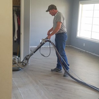 Accent Custom Flooring - a man using a machine - Flooring Near Me