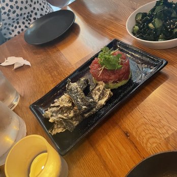 Yonsei Handrolls - Tuna tartare on edamame-avocado mash with rice crackers and sunomono in the background. - Japanese Near Me - Oakland, California Yonsei Handrolls - Tuna tartare on edamame-avocado mash with rice crackers and sunomono in the background. - Japanese Near Me - Oakland, California