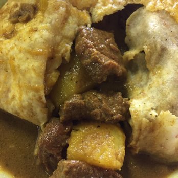 Island Foods - Goat meat and potatoes inside the roti - Caribbean Near Me - North York, Ontario Island Foods - Goat meat and potatoes inside the roti - Caribbean Near Me - North York, Ontario