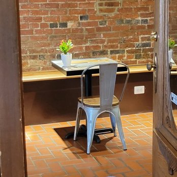 Cafe Du Soleil - 9. As we cross the hallway, we find a table. We're closer to the kitchen, so bringing our food will be easier. - Coffee & Tea Near Me - Alexandria, Virginia