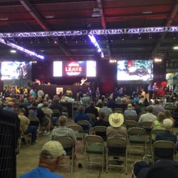 Leake Auction Company - Two cars at a time, no waiting. The screens show the bid, details on the cars, and live video.