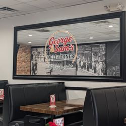 George & Sam's Deli and Diner - This is a view of the mirror inside with their logo on it. Photo taken May 24, 2026.
