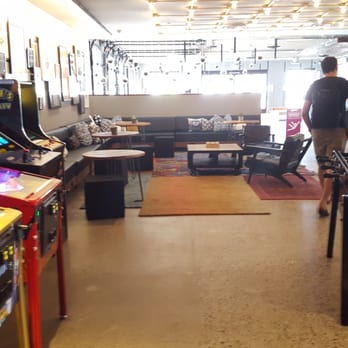 MOXY Phoenix Tempe - Lounge area with arcade games facing the entrance - Hotels Near Me - Tempe, Arizona MOXY Phoenix Tempe - Lounge area with arcade games facing the entrance - Hotels Near Me - Tempe, Arizona