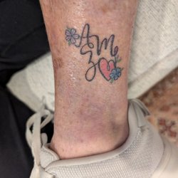 The Black Rose - These are the initials of my three kids. I waited to get this tattoo for years. Once I met Nicole, I knew it was time I love it.