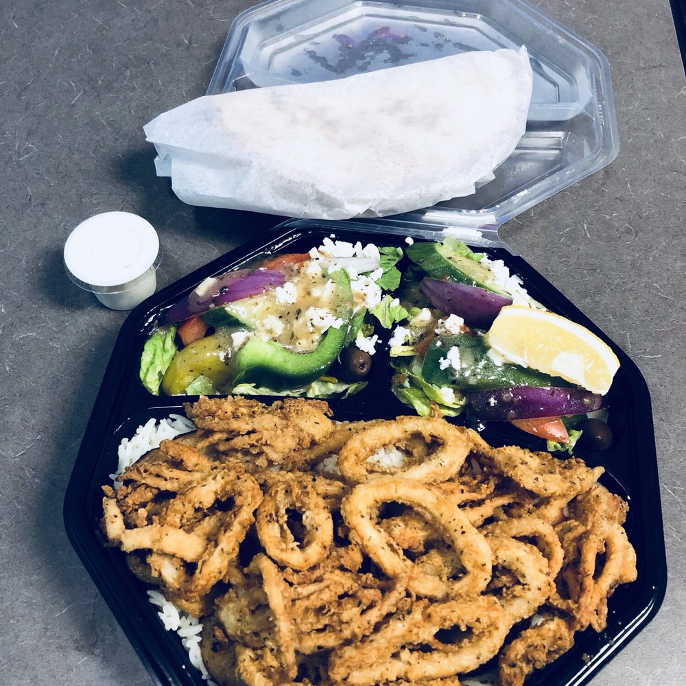 Greek To Go - The calamari platter (#24) with rice and salad, Greek cheese, garlic sauce, heated flatbread. - Greek Near Me - Ottawa, Ontario Greek To Go - The calamari platter (#24) with rice and salad, Greek cheese, garlic sauce, heated flatbread. - Greek Near Me - Ottawa, Ontario