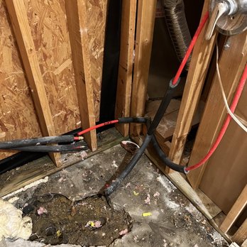 Masterpiece Tile & Grout - This is how bad the original home builder had setup this shower. Drain was way off center and leaking because the way they ran the pipe. - Grout Services Near Me