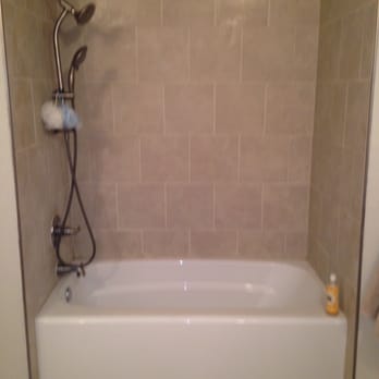 Green Action Remodeling - Shower surround using staggered 12" X 12" tile. - General Contractors Near Me - Austin, Texas Green Action Remodeling - Shower surround using staggered 12" X 12" tile. - General Contractors Near Me - Austin, Texas