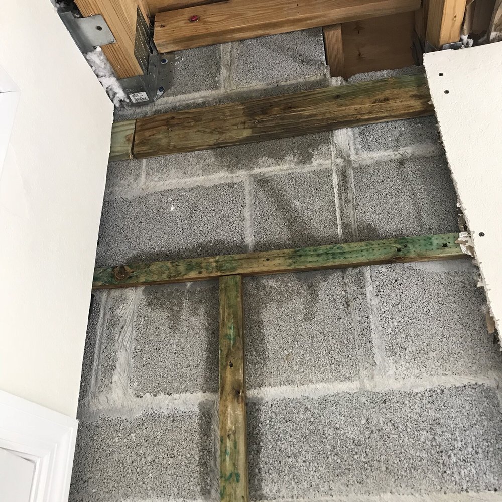 Decon Environmental - a wooden cross on the floor - General Contractors Near Me Decon Environmental - a wooden cross on the floor - General Contractors Near Me