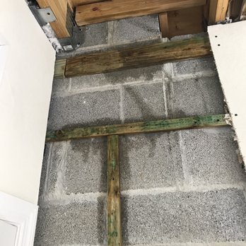 Decon Environmental - a wooden cross on the floor - General Contractors Near Me Decon Environmental - a wooden cross on the floor - General Contractors Near Me