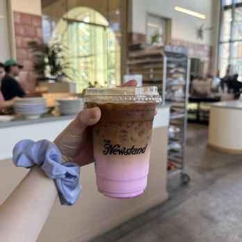 The Newstand - Iced latte with pink (rose/strawberry) syrup - Coffee & Tea Near Me - San Antonio, Texas The Newstand - Iced latte with pink (rose/strawberry) syrup - Coffee & Tea Near Me - San Antonio, Texas