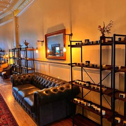 a living room with leather couches
