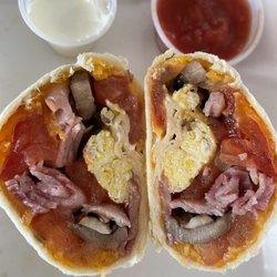 Home Plate Cafe - The inside of the breakfast burrito - egg, cheese, tomatoes, onion, mushrooms, and diced ham. Served with sour cream and salsa.