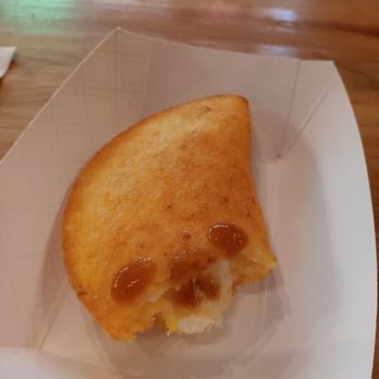 Titi’s - Papa Con Queso with hot sauce - Sandwiches Near Me - New York, New York Titi’s - Papa Con Queso with hot sauce - Sandwiches Near Me - New York, New York
