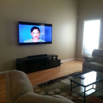 Oliver Home Technologies - Tv mounted with soundbar setup. - Home Theatre Installation Near Me Oliver Home Technologies - Tv mounted with soundbar setup. - Home Theatre Installation Near Me
