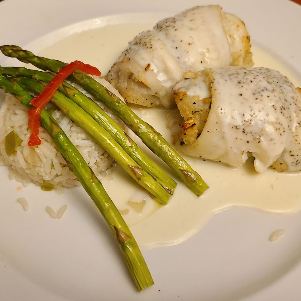 Chez Nous - Scallop Stuffed Baked Sole w/ scallop dressing topped w/ champagne cream sauce w/ rice & asparagus. - New American Near Me - Schenectady, New York