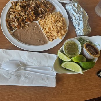 Carnitas al Estilo Michoacan - Carnitas plate ( surtido )  Comes with pork meat  Rice and beans, side of tortillas  Limes, salsas and onion with cilindro - Mexican Near Me - Moreno Valley, California
