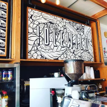 Idlewild Coffee - a sign above a coffee machine - Coffee & Tea Near Me - Austin, Texas