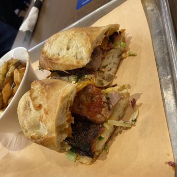 Pork & Pickle - Brisket sandwich on rustic bread - Pubs Near Me - Dorval, Quebec Pork & Pickle - Brisket sandwich on rustic bread - Pubs Near Me - Dorval, Quebec