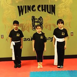 Charley's Wing Chun Kung Fu - Students receive their white belts.