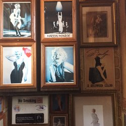 Henry's Inn - Floor to ceiling, 4 walls of Marilyn pics in the men's room.