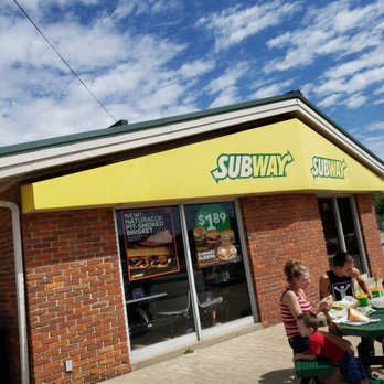 Subway - people sitting at a table outside a subway restaurant - Sandwiches Near Me - Santa Claus, Indiana Subway - people sitting at a table outside a subway restaurant - Sandwiches Near Me - Santa Claus, Indiana