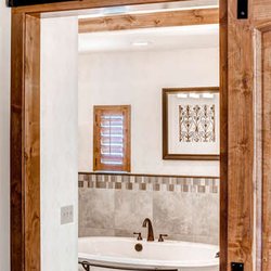 Goldberg Brothers - Goldberg Brothers barn door hardware looks great on a master bathroom door.