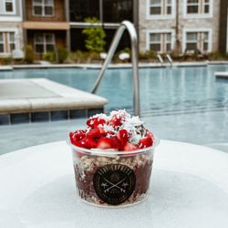 Açai Express - Valentine Bowl - Our pure acai base topped with coconut oil, granola, bananas, Nutella, strawberries and coconut flakes.