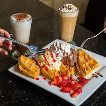 Symposium Cafe Restaurant Alliston - East Meets West waffle: perfect for sharing along with lattes. - Breakfast & Brunch Near Me - Alliston, Ontario Symposium Cafe Restaurant Alliston - East Meets West waffle: perfect for sharing along with lattes. - Breakfast & Brunch Near Me - Alliston, Ontario