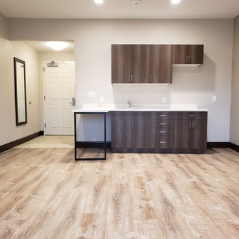 Stone and Tile Innovations - an empty kitchen with wood floors - Flooring Near Me - Aiea, Hawaii Stone and Tile Innovations - an empty kitchen with wood floors - Flooring Near Me - Aiea, Hawaii