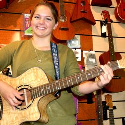 Newport Guitar & Music - Girl playing guitar